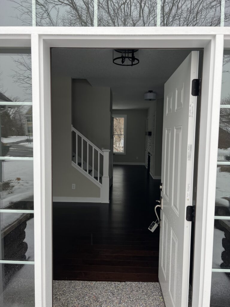 an open door leading inside a house