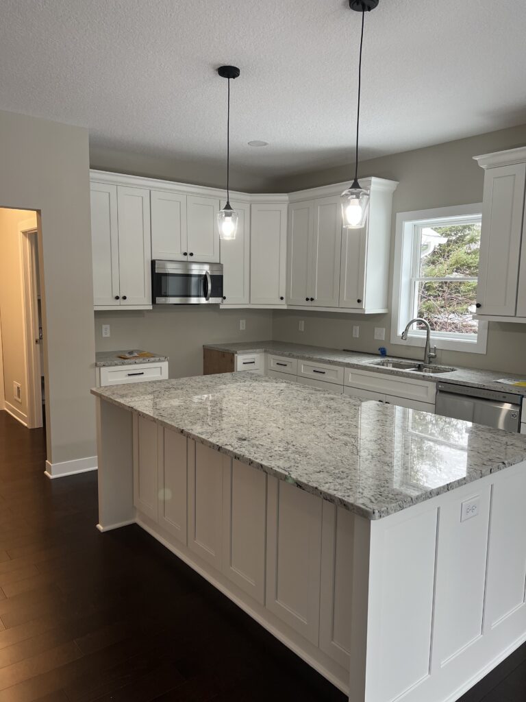 Kitchen after fire restoration and rebuild including granite countertops