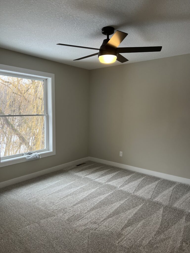 Freshly vacuumed carpet in room after structure restoration